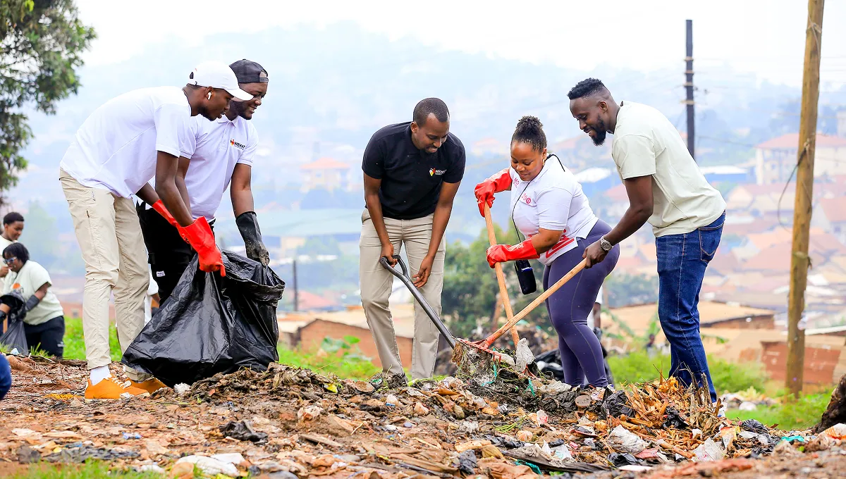 Team from WEHAT Foundation Uganda NGO collecting rubbish during community cleaning outreach in Acholi  quarters in kampala Uganda 2024